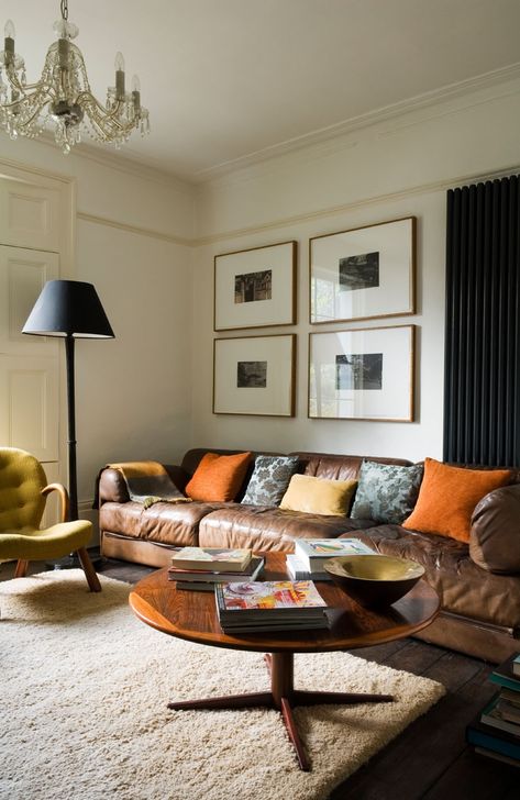 This living room has a decidedly masculine vibe with reupholstered retro furniture and a large leather sofa. Here's how to get the look https://www.fabricsandpapers.com/masculine-living-room-ideas #Lounge #Apartment #Townhouse Male Living Room Ideas, Urban Chic Living Room, Male Living Room, Mens Living Room, Manly Living Room, Masculine Living Room, London Interiors, Masculine Living Rooms, Urban Living Room