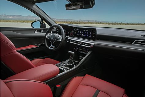 The all-new 2021 Kia K5 offers a mix of premium and sporty upholstery options including red leatherette seating, satin chrome metallic and wood-like finishes on the dashboard and door panels (depending on trim). Kia K5 Gt Line, K5 Gt Line, Red Interior Car, Mid Size Sedan, Kia K5, Kia Stinger, Luxury Vehicles, Kia Motors, Driving Games