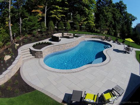 Landscape by Triad Associates, Inc. Pools With Retaining Walls Sloped Backyard, Pool Retaining Wall, Simple Pool, Pool Pavers, Luxurious Pool, Water Feature Wall, Freeform Pools, Sloped Yard, Swimming Pool Landscaping