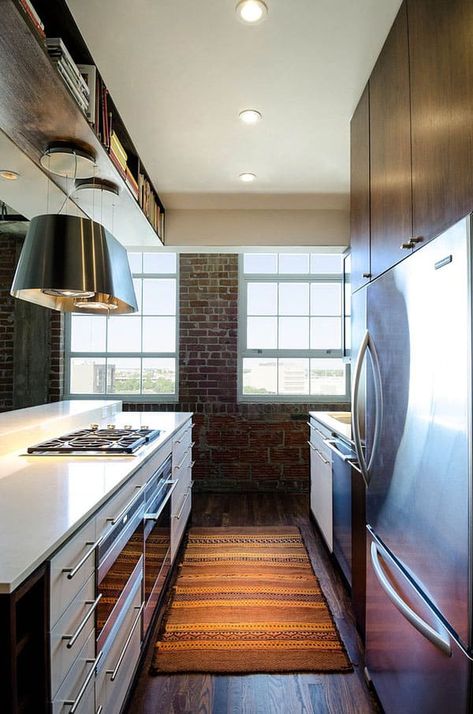 Light-filled Houston loft by CONTENT Architecture Island Vent Hood Ideas, Loft Kitchen Industrial, Kitchen Island Vent, Vent Hood Ideas, Island Vent Hood, Island Hood, Hood Ideas, Contemporary Loft, Hood Vent