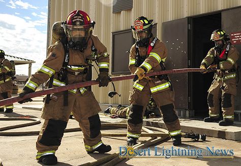 Air Force photograph by Airman 1st Class Frankie D. Moore ----  Air Force firefighters from the 355th Civil Engineer Squadron pull a fire hose into a simulated burn site at Davis-Monthan Air Force Base, Ariz., Oct. 19, 2017. In addition to protecting installation assets, Air Force firefighters collaborate with and host training for local fire departments. Air Force Firefighter, Fire Training, Fire Hose, Air Force Bases, Military Life, Civil Engineering, Fire Department, Photo Illustration, Firefighter