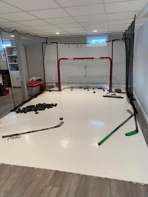 Hockey Garage Ideas, Ice Hockey Bedroom, Indoor Hockey Rink In House, Hockey Training Room, Hockey Basement Ideas, Basement Hockey Rink, Kids Hockey Bedroom, Hockey Bag Storage, Hockey Room Ideas