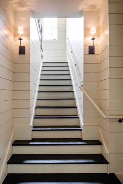 Wood paneling adds rustic charm to this beautiful staircase.  #staircase #kitchendesign "A Fresh Take On Traditional Design" http://www.StyleBlueprint.com Farmhouse Stairs, Residence Design, Shiplap Cladding, Basement Stairs, Gorgeous Houses, Foyer Decorating, Neutral Interiors, Basement Flooring, Unfinished Basement