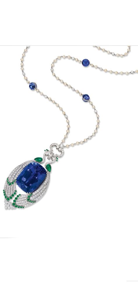 The necklace centring on a tanzanite weighing 90.08 carats, embraced by a pair of peacocks set with circular-cut diamonds and emerald cabochons, to a diamond-set openwork surmount, completed by a platinum neckchain set with seed pearls and collet-set diamonds, interspersed by tanzanite cabochons. Tanzanite cabochons together weighing approximately 24.30 carats. Diamonds and emeralds altogether weighing approximately 6.50 and 2.50 carats respectively. Mounted in platinum. Length approximately 86c Pearl Diamond Pendant, Emerald Cabochon, Tanzanite Necklace, Long Necklaces, Mom Jewelry, Emerald Necklace, Cabochon Pendant, Pearl Diamond, Diamond Set