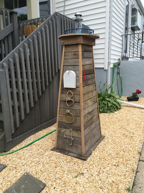 Lighthouse mailbox. We made this for my sister, it looks great in her front yard! Lighthouse Yard Decor, Beach Themed Front Yard, Lighthouse Mailbox Ideas, Lake House Mailbox Ideas, Beach Mailbox Ideas, Nautical Mailbox Ideas, Diy Lighthouse Outdoor, Yard Lighthouse, Coastal Mailbox