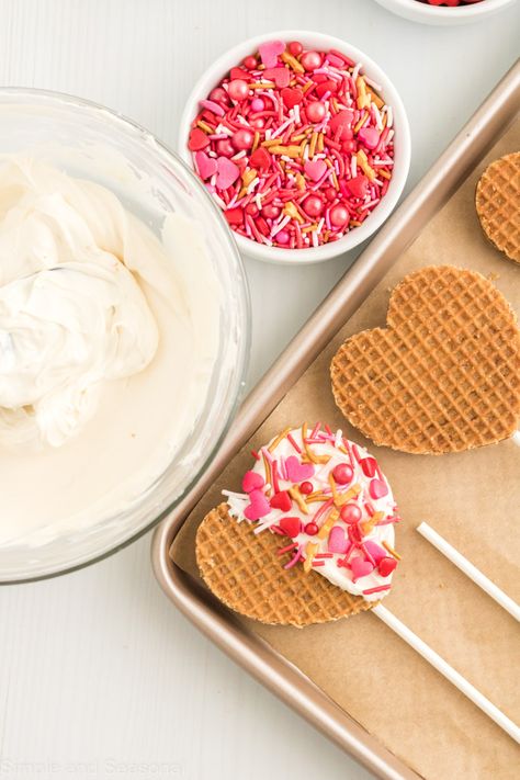 Valentine's Day Waffle Pops are the perfect party treat! Next time, skip the cupcakes and hand out these cute treats instead. Easy Valentines Snacks, Valentines Day Cookie Recipe, Waffle Pops, Valentines Snacks, Waffles Easy, Heart Shaped Cookies, Trifle Recipe, Valentines Day Cookies, Dried Strawberries