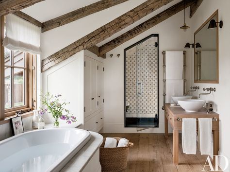 In the master bath, Lacava basins are paired with Waterworks sink fittings; the shower is lined with Exquisite Surfaces tile. Frances Loom, Loft Bathroom, Attic Bathroom, Casa Country, Attic Renovation, Attic Remodel, Modern Farmhouse Bathroom, Rustic Bathroom, Dream Bathroom