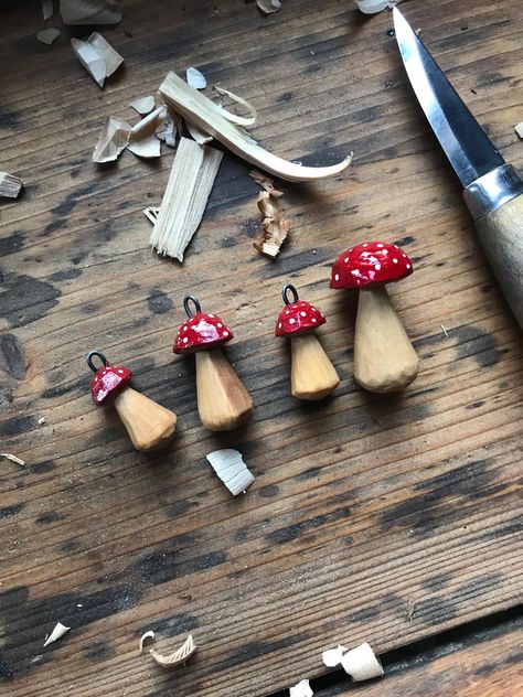 Handcarved amanita mushroom pendants.  You can use them as keychains, amulets or zipper charms or even hang them in your car rear view mirror.  Made from leftover wood. Zero waste and sustainable wooden accessories. Perfect gift for a nature lover.  Painted with acrylics. Finished with linseed oil and Osmo oil wax to protect the paint.  The set consists of one smaller and one bigger mushroom.  EACH PAIR COMES WITH A LEATHER STRING! Art Sculpture En Bois, Whittling Projects, Magical Mushroom, Carved Jewelry, Simple Wood Carving, Wood Carving For Beginners, Mushroom Crafts, Mushroom Necklace, Dremel Wood Carving