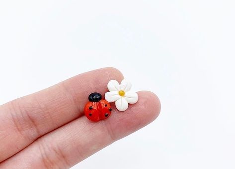 PhoYoSelf on Instagram: “Mixmatched earrings - ladybug and flower 🐞 🌸 #polymerclay #polymerclayearrings #polymerclayjewelry #polymerclayladybug #ladybugearrings…” Clay Cute, Clay Earring, Bungalow House, Polymer Clay Jewelry, Polymer Clay Earrings, Clay Earrings, Bungalow, Polymer Clay, Stud Earrings