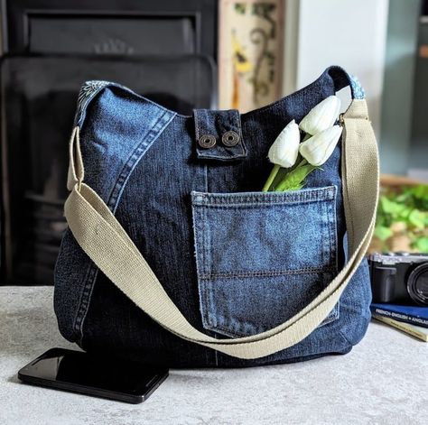 Denim patchwork hobo crossbody bag with asymmetrical design and gold chain #Patchwork #Repurposed_Denim #Denim_Crossbody #Crossover_Bags Denim Hobo Bag, Repurposed Denim, Denim Crossbody, Crossover Bags, Hobo Crossbody Bag, Bag Mockup, Recycled Jeans, Jean Pockets, Leftover Fabric