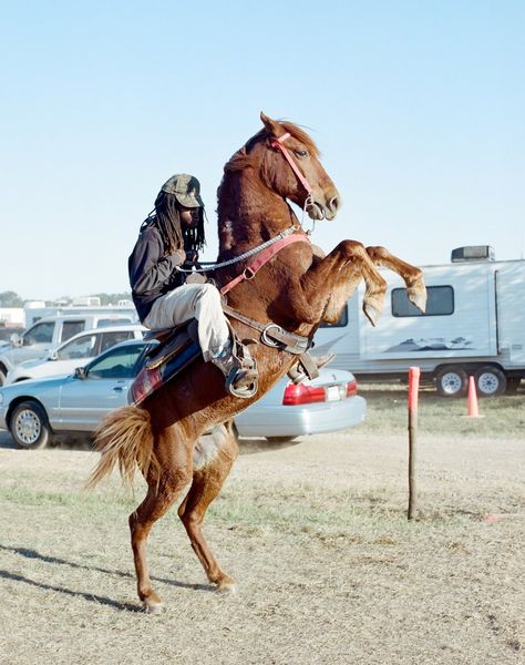 A man doing a trick at a trail ride in Southern Louisiana, 2014. Trend Board, Modern Cowboy, Black Cowboys, Funny Photoshop, Urban Cowboy, San Francisco Art, Cowboy Horse, Central City, Dressage Horses