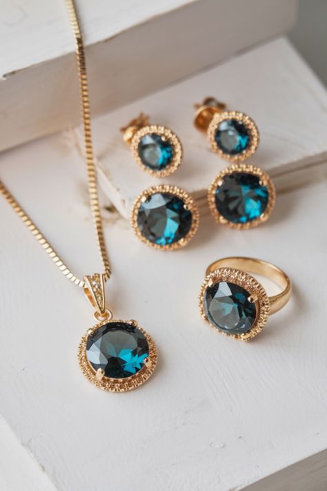 Make a bold statement with this trendy blue gemstone jewelry design. This elegant set, featuring a stunning pendant, earrings, and ring, is perfect for fashion-forward women who love a touch of sophistication. The rich blue stones set in gold create a timeless look that complements any outfit, whether for a special occasion or everyday elegance. Luxury Blue Topaz Classic Jewelry, Elegant Topaz Jewelry With Large Stone, Elegant Blue Topaz Gemstone Jewelry, Elegant Blue Topaz Oval Cabochon Jewelry, Elegant Gia-certified Blue Topaz Jewelry, Gemstone Jewellery Design, Everyday Elegance, Blue Stones, Bold Earrings