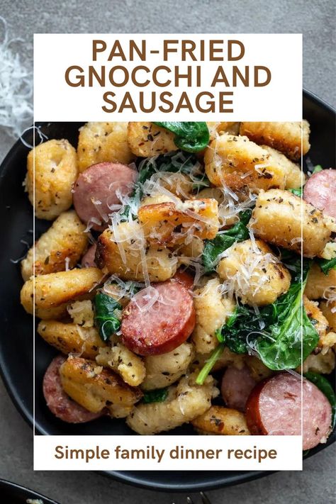 Pan-fried gnocchi with sausage and spinach on a black plate. Italian Sausage And Gnocchi Recipes, Kielbasa Gnocchi, Gnocchi And Chicken Sausage, Kielbasa Dinner, Bacon Gnocchi, Gnocchi With Sausage, Gnocchi With Spinach, Fried Gnocchi, Pan Fried Gnocchi