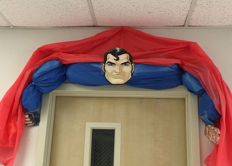 Superman door decor Super Hero Hallway Decorations, Superman Decorations Ideas, Superhero Headquarters, Superhero Door, Hero Central Vbs, Superhero Vbs, Superman Birthday Party, Superman Party, Superhero Classroom Theme