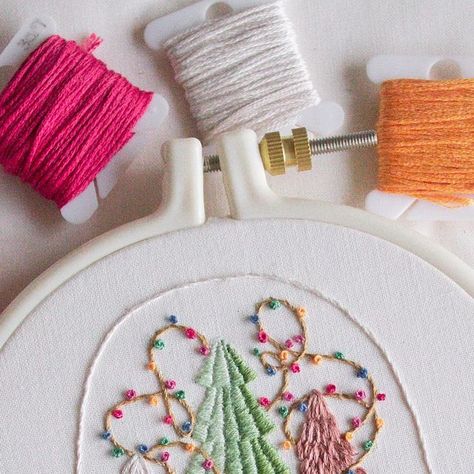 Aly Ploof on Instagram: "Today I wanted to share another pattern reveal from my new Christmas embroidery book “Handmade Holiday” coming this November! ✨ 

This pattern is called “Rainbow Snow Globe” and was inspired by the adorable cloche snow globes with mini trees and fairy lights that have become so popular recently! This pattern is definitely one of the more complex ones in the book, but such a satisfying one to stitch 🫶🏻 

You can preorder Handmade Holiday for the physical copy to be sent after Nov. 19th, or purchase the Ebook right now if you’re ready to get going. There will be a link in my bio & stories to order through! ✂️" Light Embroidery, Book Handmade, Embroidery Book, Fairy Light, Christmas Embroidery, Handmade Holiday, Snow Globe, Fairy Lights, Snow Globes