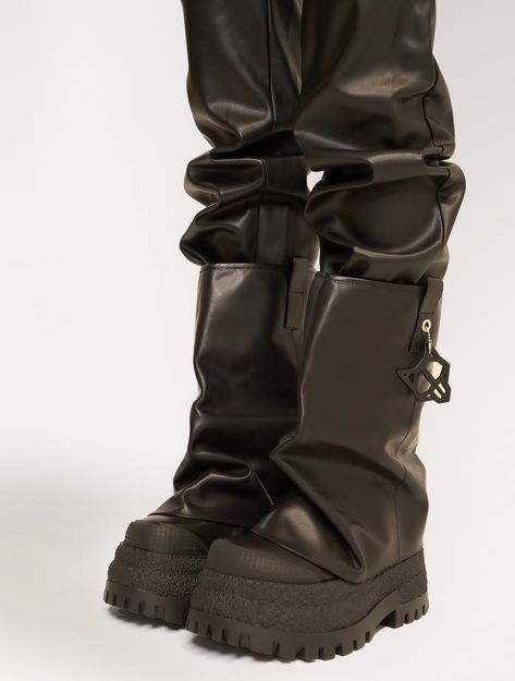 Product Description Introducing Disturb, our latest 90mm chunky boot with an asymmetric toe shape, designed for those who appreciate bold fashion statements. This boot features a wide leg fit for comfort and style, complemented by a distinctive Wolfe head ball charm for added flair. It also includes new rubber toe and heel pieces, combining durability with a modern aesthetic. Perfect for trendsetters seeking both edge and elegance, this boot is a must-have for any fashion-forward wardrobe. Featu Chunky Boots Street Style, Black Chunky Platform Moto Boots For Streetwear, Edgy Chunky Platform Mid-calf Boots For Streetwear, Chuncky Boots, Oversized Boots, Edgy Knee-high Boots With Chunky Platform, Luxury Black Chunky Platform Boots, Wolfe Boots, Alternative Boots