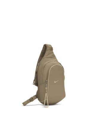 The Nike Sportswear Essentials Sling Bag is a comfortable carry-all with room for storing a reusable water bottle, packable jacket and more. Additional zippered pockets and an adjustable shoulder strap help you stay organized and ready for wherever the day takes you. This product is made with at least 50% recycled polyester fibers. Shown: Khaki/Sanddrift/Sanddrift Style: DJ9796-247 Nike Sling Bag, Packable Jacket, Stay Organized, Nike Sportswear, Sling Backpack, Sling Bag, Reusable Water Bottle, Wallets, Shoulder Strap