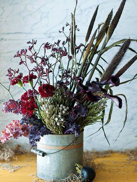 For an organic look straight out of nature, be a little eclectic in your fall display and arrangements. Gather a variety of flowers, stems, fillers, and twigs and arrange at random. Use a rustic or vintage-looking vessel, such as a galvanized bucket, to complete the look. Autumn Display, Fall Arrangements, Flower Bucket, Flowers Arrangements, Nature Inspired Decor, Trendy Flowers, Fabulous Fall, Flowers Garden, Floral Display