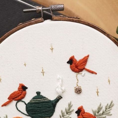 Magnus & Quill Embroidery on Instagram: "One of my favourite new patterns! These sweet cardinal birds decided to make a spot of tea while enjoying a good read among the table arrangements 😆 Oranges seemed fitting and give it a slight Christmas feel! I can’t wait for Christmas holidays, and to just drink tea and read books for days 🥰📚 Available as a PDF Digital Download on Etsy, this Pattern includes: 🎄Step By Step instructions (with photos of the actual pattern being stitched) 🎄Colour Guide (dmc) 🎄Supply List (including needle size, hoop size, best fabric to use) 🎄YouTube Tutorials (access to private YouTube videos showing the pattern being stitched so you can follow along or reference easily!) #embroiderypattern #beginnerembroidery #dmcthreads @dmc_embroidery @michaelsstores @lovec Cardinal Knitting Pattern, Embroidered Cardinal Bird, Red Bird Embroidery, Cardinal Embroidery Pattern, Cardinal Embroidery, Embroidered Cardinal, Christmas Hand Embroidery, Colour Guide, Good Read