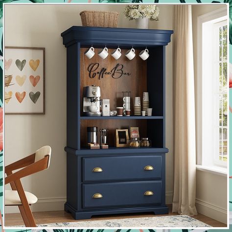 Looking to add a stylish touch to your kitchen? Check out these 13 creative coffee bar ideas for your kitchen makeover. Whether you prefer a rustic, modern, or minimalist design, these coffee bar setups will inspire you to create the perfect cozy corner for your morning brew. Upgrade your kitchen with these coffee bar in kitchen ideas today! Coffee Station Armoire, Dark Blue Coffee Bar, Bookshelf Into Coffee Bar, Bookshelf Coffee Station, Wooden Coffee Bar Ideas, Coffee Bar In Cupboard, Coffee Bar Ideas For Men, Wardrobe Coffee Station, Tv Stand Coffee Bar