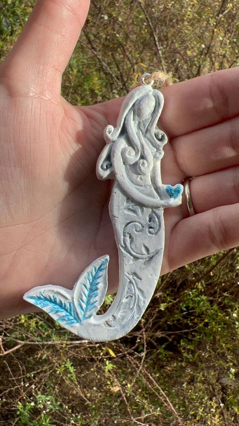 I made this little clay mermaid ornament because I've always loved the magic of the ocean and the whimsy of mermaids. Each one is shaped and painted by hand, so no two are exactly alike. It's a small, playful piece that I imagine could hang on a tree, in a window, or anywhere that needs a bit of that sea-inspired charm. It's one of my favorite things to create, and I hope it brings a little magic to whoever has it. ~Measurements~ Length ~4 inches  Width ~1 inch Mermaid Ornament, Sea Inspired, Gift Decorations, Art Object, Mermaid, Sculpture, Bring It On