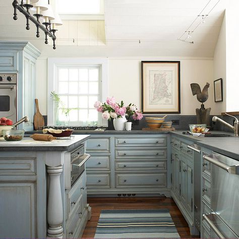 Cabinets with a pretty antique blue finish are the highlight of this kitchen.  More kitchen inspiration: http://www.bhg.com/kitchen/ Blue Painted Cabinets, Shabby Chic Kitchen Cabinets, Glazed Kitchen Cabinets, Blue Kitchen Designs, Navy Cabinets, Cocina Shabby Chic, Distressed Kitchen, Kitchen Island Cabinets, Blue Kitchen Cabinets