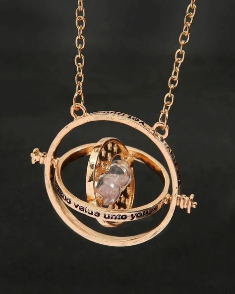 Turn back time with the iconic Time-Turner necklace ⏳✨. A symbol of magic and mystery, this Harry Potter accessory is perfect for those who wish to relive every magical moment. #HarryPotter #TimeTurner #MagicalJewelry Spinning Jewelry, Time Turner Necklace, Hourglass Pendant, Time Necklace, Time Turner, Golden Pendant, Earring Pins, Sigil Magic, Sweater Chain