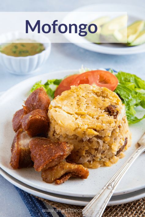 Mofongo is an easy traditional Puerto Rican dish made with delicious fried green plantains mashed with garlic, pork crackling (chicharron), and served with an easy garlic mojo sauce. This recipe is very similar to the mofongo Dominicano and can be made in under 30 minutes! #smartlittlecookie #puertorican #recipe #dinner #caribbean #food #Dominicano Mofongo Dominicano, How To Make Mofongo, Dominican Chicken, Mofongo Recipe, Dominicano Recipes, Mashed Plantains, Dominican Recipes, Puerto Rican Foods, Fried Plantains