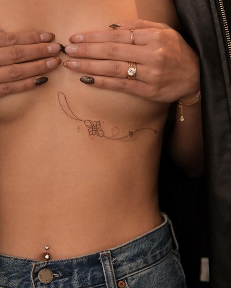 This tattoo features the Tibetan Endless Knot, a sacred symbol in Buddhism representing interconnectedness, eternity, and the cyclical nature of life and existence. The knot flows elegantly with fine lines and is adorned with delicate tassels, adding a sense of movement and grace to the design. The overall composition reflects harmony and balance, symbolizing the unity of wisdom and compassion. #handpoke #sonyapokesyou #endlessknottattoo #sanfranciscotattoo Baybayin Tattoo, Eternity Tattoo, Buddhism Tattoo, Life Path Number 7, San Francisco Tattoo, Tibetan Tattoo, Balance Tattoo, Sanskrit Tattoo, Endless Knot