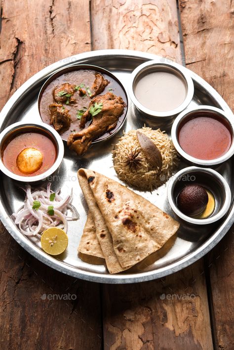 Indian Chicken Platter by stockimagefactory. Kolhapuri Chicken Thali is a popular Indian Non Vegetarian food platter #Sponsored #stockimagefactory, #Kolhapuri, #Platter, #Indian Lunch Thali Indian, Chicken Thali Indian, Chicken Thali, Dal Bhat, Chicken Platter, Tiffin Ideas, Recipes With Fruit Cocktail, Platter Food, Khana Khazana