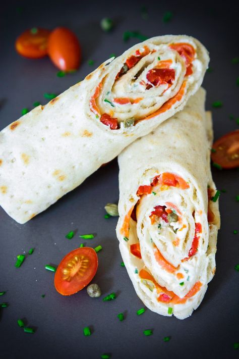 Smoked salmon, chopped chives, and cream cheese spread wrapped in a lavash flatbread with capers and roasted red peppers. An easy to make salmon wrap recipe Smoked Salmon Wrap, Salmon Wraps, Smoked Salmon Cucumber, Salmon Appetizer Recipes, Salmon Cucumber, Cucumber Appetizers, Salmon Wrap, Smoked Salmon Appetizer, Salmon Appetizer