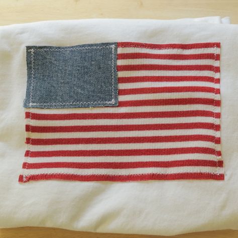 The American Flag Tee by Asho Designs 🇺🇸 A comfortable and fashionable shirt that gives off a classic American vibe. Each American Flag is made with recycled fabrics and assembled onto a white Comfort Colors t-shirt. Get yours today at ashodesigns.com! #americanflagshirt #americanstyle #america #summerfashion #4thofjuly #4thofjulyoutfit #ashodesignsapparel Patchwork 4th Of July Shirt, Usa Patchwork Shirt, Diy American Flag Shirt, Diy 4th Of July Shirts Patchwork, Patchwork Tops Ideas, Diy Fourth Of July Shirt, Diy Patchwork Shirt, Preppy Designs, Patchwork Tshirt