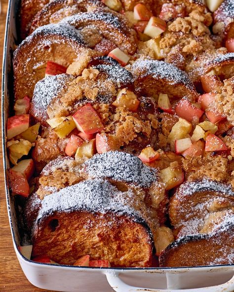 This apple-cinnamon french toast casserole recipe is taking over your holiday menu plans. Combine French toast luxury with the ease of make-ahead bread puddings for a soothing Saturday morning breakfast. For the casserole, you'll need unsalted butter, large eggs, half-and-half, apple butter, ground cinnamon, vanilla extract, grated nutmeg, challah or brioche bread, Honeycrisp apples, granulated sugar and all-purpose flour. Fruit Casserole, Cinnamon French Toast Casserole, Holiday Breakfast Casserole, Apple Cinnamon French Toast, Brunch Party Food, Make Ahead French Toast, Brunch Casserole Recipes, Make Ahead Brunch Recipes, French Toast Casserole Recipe