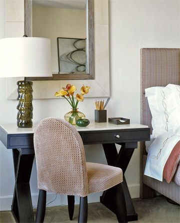 Think dual purpose to make the most of bedroom space. A marble-top desk can serve as a side table as well as a writing desk with the addition of a comfortable chair. Bedroom With Desk As Nightstand, Desk As Bedside Table, Desk As A Nightstand, Desk As Nightstand Bedroom, Desk At End Of Bed, Desk Next To Bed Ideas, Mirror Behind Bed, Desk Beside Bed, Writing Desk In Bedroom