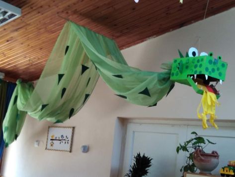 Dragon Ceiling Decoration, Hanging Dragon Decoration, Fairy Tale Ball Decorations School, Dragon Library Display, Fairy Tale School Theme, Medieval Classroom Decor, Dragon Bulletin Board Ideas, Medieval Party Decorations Diy, Castle Theme Vbs