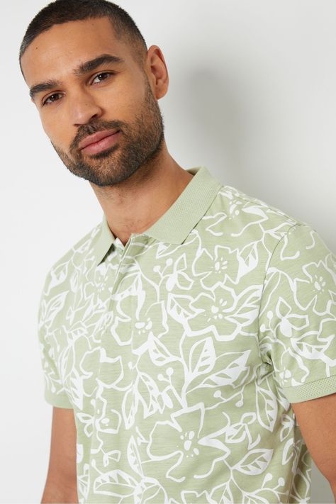 Freshen up your summer wardrobe with this floral print jersey polo shirt from Threadbare. In an all over abstract floral print, this short sleeve polo shirt has a hidden placket with branded buttons and a birdseye textured collar and sleeve cuffs. Made from a cotton jersey fabric for comfort and finished with a woven Threadbare label on the hem. Perfect in the summer sun on holiday, and also a great piece for barbecues with friends and family. Machine washable. 100% Cotton. Green Polo Shirt, Mens Polo T Shirts, Green Polo Shirts, Petite Jumpsuit, Green Polo, Printed Polo Shirts, Cotton Jersey Fabric, Abstract Floral Print, Boys Coat