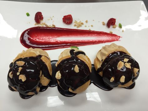 Peanut Butter Mousse Profiteroles Profiteroles Plating, Fine Dining Plating, Cocina Ideas, Plated Dessert, Plating Ideas, Come Dine With Me, Peanut Butter Mousse, Food Tech, Pastry Board