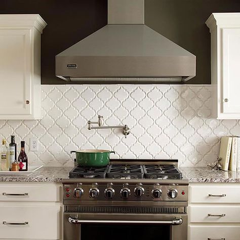 Quatrefoil-pattern tiles add subtle dimension and texture to this pretty kitchen: http://www.bhg.com/kitchen/backsplash/behind-the-range-tile-backsplash/?socsrc=bhgpin040714patternedtilebacksplash&page=4 Dr Kitchen, Backsplash Arabesque, Pot Fillers, Range Tile, Trendy Kitchen Tile, Trendy Kitchen Backsplash, Backsplash Patterns, Patterned Tile Backsplash, Moroccan Lantern