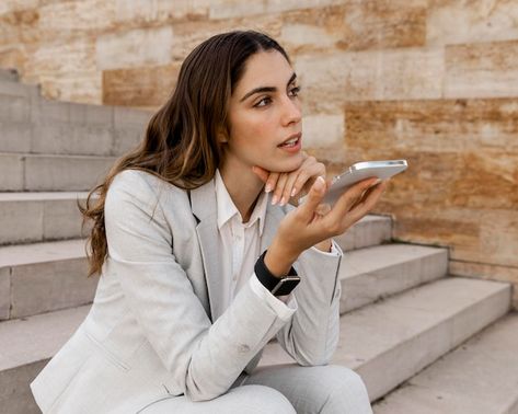 Businesswoman talking on the phone while... | Free Photo #Freepik #freephoto Working On Laptop, Event Agency, Brand Refresh, Talking On The Phone, Women Talk, Human Poses Reference, On Phone, Human Poses, Girl Talk