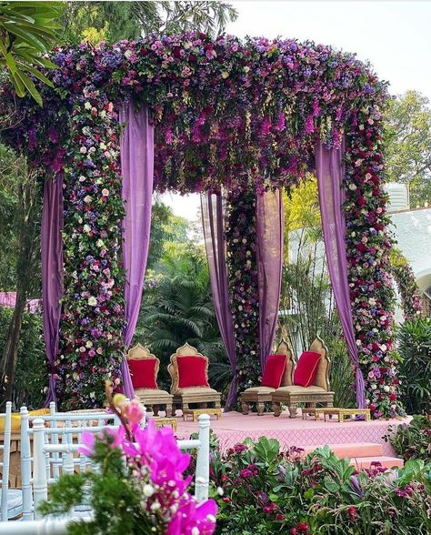 Traditional or contemporary, Indian weddings are never complete without the lavish use of flowers. Here are some ideas to beautify your wedding mandap decoration with flowers while keeping your budget, colour palette and style in check. Purple Indian Wedding Decor, Indian Wedding Theme Ideas Color Schemes, Purple Indian Wedding, Wedding Mandap Decor, Puja Mandap, Shaadi Decor, Outdoor Wedding Reception Decorations, Mandap Decoration, Mandap Design