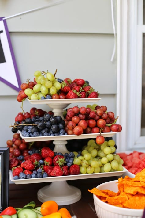 UW Graduation party food table. purple and gold party.  Use a cake stand to serve fruit! Graduation Party Food Table, Grad Party Food, College Grad Party, Graduation Food, Backyard Graduation Party, Outdoor Graduation Parties, Outdoor Graduation, Senior Graduation Party, Graduation Party Foods