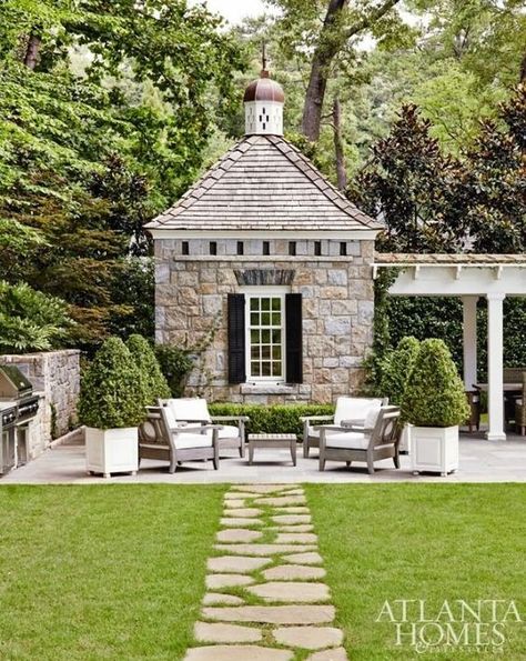 A stone pathway leads to the perfect outdoor patio and charming stone poolhouse. Stone Pathway, Atlanta Homes, Porch Patio, Outdoor Rooms, Pool Houses, Outdoor Design, Pool House, Clematis, Wisteria