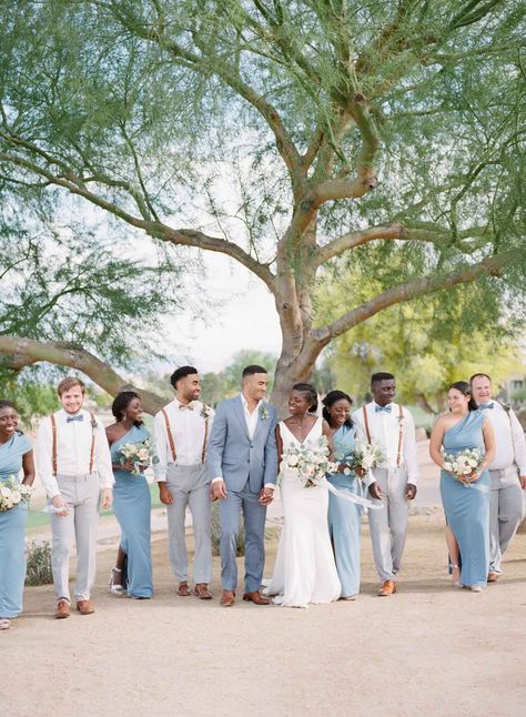 Meet Enyo and Etienne who tied the knot in the Spring of 2021 at Palm Valley in Goodyear, AZ. These love birds were an absolute joy to work with every step of the way. We love how they intertwined elements of their faith and heritage and wrapped it all together with a stunning color palette of dusty blues, creams, and rose gold accents. Every detail was so thoughtfully chosen and perfectly accented the stunning mountain views that captured the bride and groom's hearts. Join us as we reminisce ab Groom Attire Light Blue, Light Blue Suit Wedding Party, Mix And Match Wedding Party, Light Blue Wedding Groomsmen, Light Blue Wedding Party Attire, Bridal Party Attire Color Schemes, Summer Wedding Party Attire, Beach Wedding Groomsmen Attire, Light Blue Bridal Party