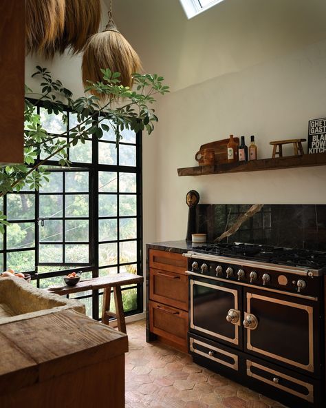 The kitchen in @aurorajames's Laurel Canyon home features some treasured finds, including a 1,000-pound stone sink. (“Getting that in was a whole thing,” she admits.) There are also the Congolese grass pendants that she picked up from a street vendor in Greece. (“They make the kitchen feel so much more textural and cultural to me,” she says.) Take a tour of the vibrant retreat in our September cover story at the link in our bio. Photo by @frankfrancesstudio; styling by @amykchin; design by @... Laurel Canyon Home, Architectural Digest Kitchen, Stone Kitchen Sink, House Cozy, Earthy Home, Eclectic Interior Design, Cottage Renovation, Stunning Interior Design, Laurel Canyon