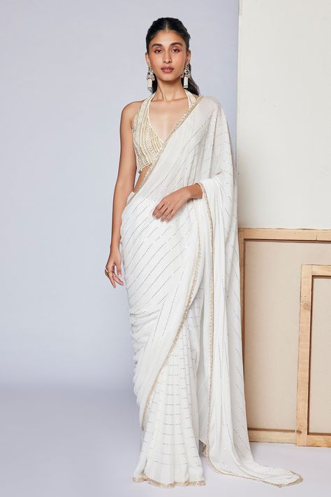 Shop for these amazing collections of White Saree: Georgette Embellished Sequins Halter Ivy With Bralette For Women by Chamee and Palak online at Aza Fashions. Off White Georgette Saree, White Sequence Blouse, White Sari Wedding, White Saree Designs, White Halter Neck Blouse, White Saree Blouse Design, White Saree Aesthetic, White Saree Look, White Indian Outfit