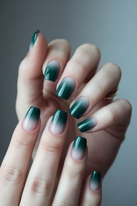 The photo shows a hand with long, coffin-shaped nails featuring an ombre design. The nails transition smoothly from a nude base to a dark green tip, creating a soft and elegant gradient effect. Pink Shimmer Nails, Ombre Nail Design, Dreamy Effect, Ombre Nail Art, Ombre Manicure, Latest Nail Designs, Kpop Nails, Nail Shimmer, Ombre Nail