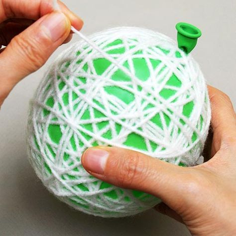 Yarn or String Christmas Ornaments | Kids' Crafts | Fun Craft Ideas | FirstPalette.com Yarn Ornaments Diy Kids, Diy Yarn Ornaments Christmas, String Ornaments Diy, Diy Yarn Ornaments, Christmas Yarn Crafts, String Ornaments, Yarn Ornaments, Ornaments Diy Kids, Yarns Ornaments