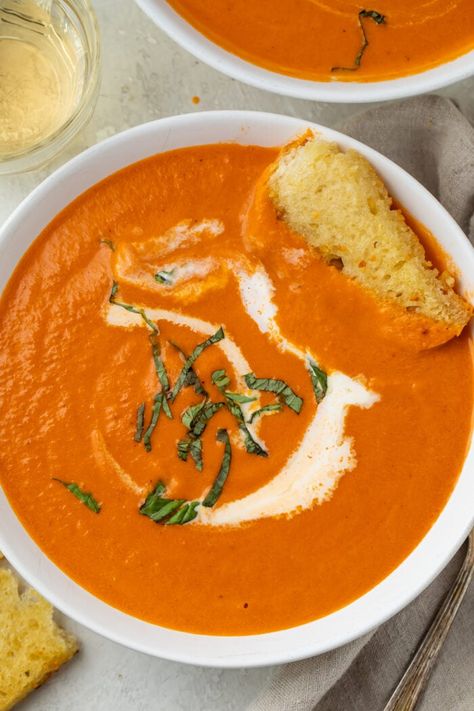 This tomato bisque is creamy, loaded with flavor, and simply delicious. Perfect with grilled cheese sandwiches or a crusty loaf for dipping, this is our go-to tomato soup recipe. Classic, perfected. Easy Tomato Bisque, Creamy Tomato Bisque, Tomato Bisque Recipe, Using Fresh Tomatoes, Tomato Bisque Soup, Chicken Pesto Sandwich, 40 Aprons, Bisque Recipe, Tomato Bisque