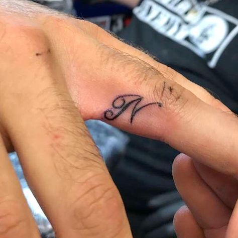 Ring finger tattoo initial ‘N’ Finger Tattoo Initial, N Letter Tattoo, Ring Finger Tattoo, N Tattoo, N Letter, Ring Tattoo, Letter Tattoo, Tattoos Infinity, Tattoo Spots