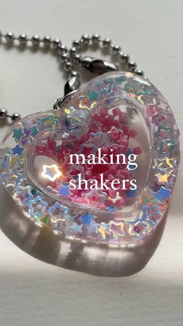 arpeggi accessories on Instagram: "here’s a behind the scenes look at the process of making these shakers! ヽ( ★ω★)ノ the melon heart shaker (green one) is still available on my website now! 🍈💕 later this week, I’ll be dropping a new charm bracelet design that will have restocks!! 🥳 and last but not least, if you’re a fan of these shakers, you’re gonna love what’s to come in the future drops…a hint: a favorite character will be turned into a shaker (￣ω￣;)！！ . . . . . . #resin #jewelry #handmade Shaker Charm, New Charmed, Bracelet Design, Easy Diy Art, Diy Keychain, Diy Stuffed Animals, Etsy Handmade, Diy Beads, Jewelry Handmade